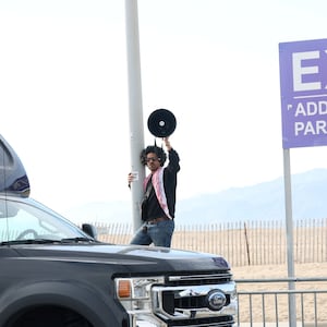 A person protests in support of Palestinians using a megaphone outside the 39th Film Independent Spirit Awards venue, in Santa Monica, California, U.S. February 25, 2024. 