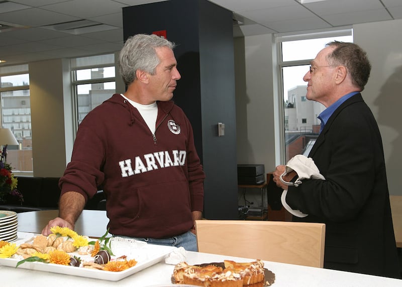 Jeffrey Epstein and Alan Dershowitz chat with each other in an intimate and relaxed portrait.