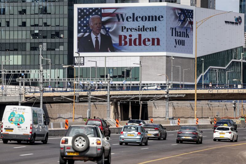 A photo including a billboard welcoming US President Joe Biden in Tel Aviv