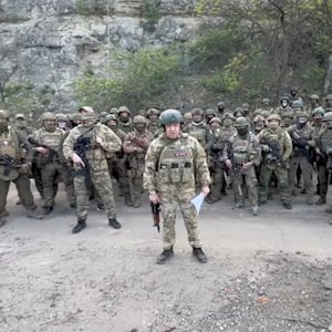 Founder of Wagner private mercenary group Yevgeny Prigozhin makes a statement as he stand next to Wagner fighters in an undisclosed location in the course of Russia-Ukraine conflict, in this still image taken from video released May 5, 2023.