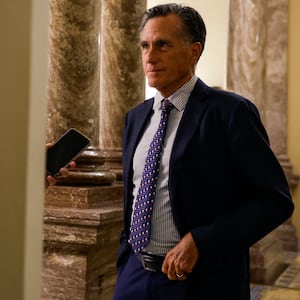 Mitt Romney speaks to a reporter in D.C.