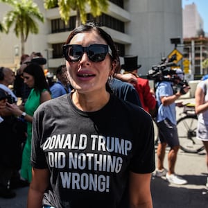 Right wing pundit Laura Loomer stands amid a rally outside a US Federal Courthouse with supporters of former President Donald Trump.