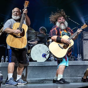 Kyle Gass, Jack Black, and bassist John Spiker of Tenacious D perform at PNC Music Pavilion on Sept. 6, 2023, in Charlotte, North Carolina.