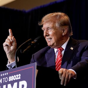 Former President Donald Trump gestures as he speaks during a rally ahead of the New Hampshire primary election in Concord, New Hampshire.