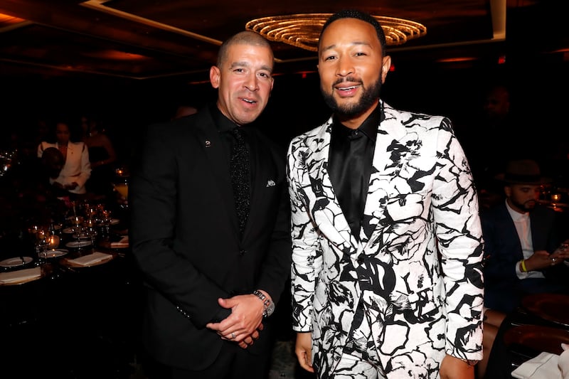 A photo of Rigo Morales and John Legend at the 64th Annual Grammy Awards in April 2022.