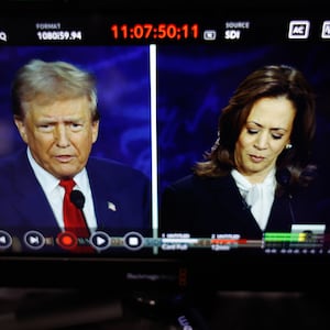 Donald Trump and Kamala Harris are seen on a screen as they debate for the first time during the presidential election.