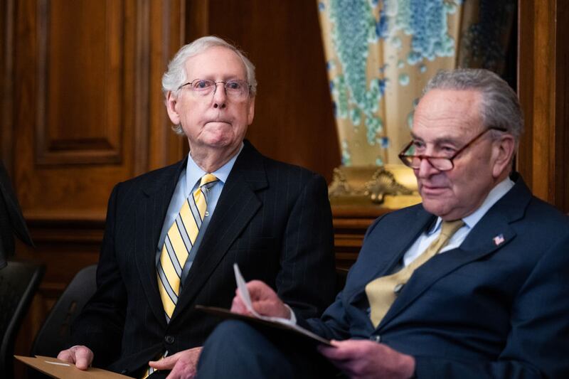 Senate Minority Leader Mitch McConnell, Senate Minority Leader Mitch McConnell (R-KY), left, and Senate Majority Leader Charles Schumer, (D-NY), attend a Menorah lighting to celebrate the eight-day festival of Hanukkah.