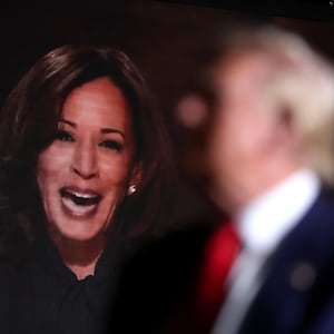 Republican presidential nominee, former U.S. President Donald Trump, watches a video of Vice President Kamala Harris during a campaign rally at The Expo at World Market Center Las Vegas on September 13, 2024 in Las Vegas, Nevada.