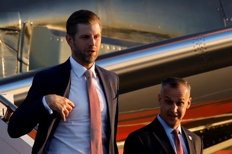 Eric Trump and Corey Lewandowski walking off the Trump campaign plane