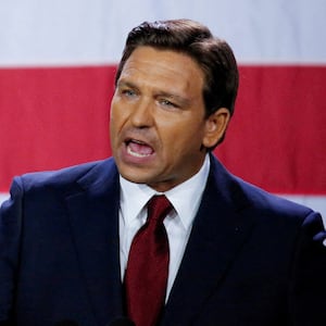 Ron DeSantis speaks passionately in front of a U.S. flag