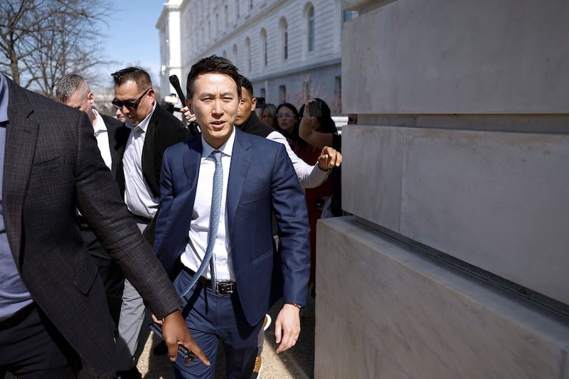 Shou Zi Chew walks outside from the Russell Senate Office Building