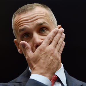 President Donald Trump's former campaign manager, Corey Lewandowski, looks on and covers his mouth with his hand before testifying before the House Judiciary Committee.