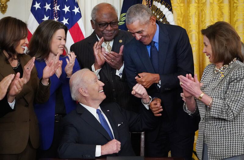 US Representative Angie Craig (D-MN), second from left, with Vice President Kama Harris, US Representative James Clyburn (D-SC), Barack Obama and Nancy Pelosi (D-CA) with Joe Biden