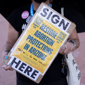 A pro-abortion protester holding a sign