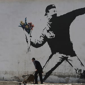 articles/2016/03/11/the-secret-life-of-the-real-banksy-robin-gunningham/160310-hines-banksy-tease_rzedke