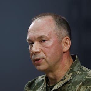 Colonel general Oleksandr Syrskyi pictured before a blue background