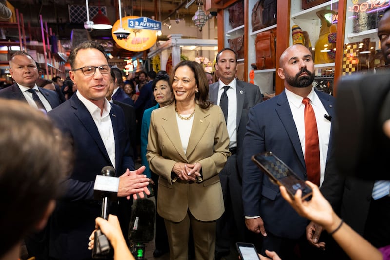 Vice President Kamala Harris and Pennsylvania Governor Josh Shapiro (L) speak to the press while making a stop in Philadelphia.