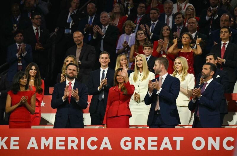 People stand to applaud former US First Lady Melania Trump (C) during the last day of the 2024 Republican National Convention in Milwaukee.