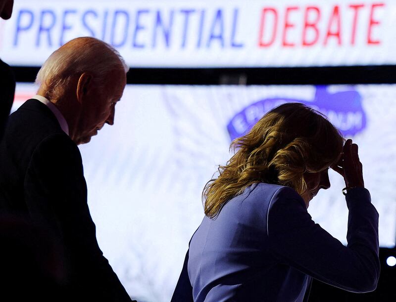 President Joe Biden walks offstage with first lady Dr. Jill Biden at the conclusion of his debate with Republican presidential candidate Donald Trump.