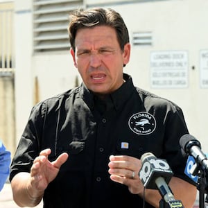 Florida Gov. Ron DeSantis, right, and Florida Department of Emergency Management Director Kevin Guthrie, left, speak at a press conference Monday.