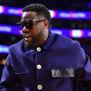 Kevin Hart walks courtside as he attends a basketball game in Los Angeles.