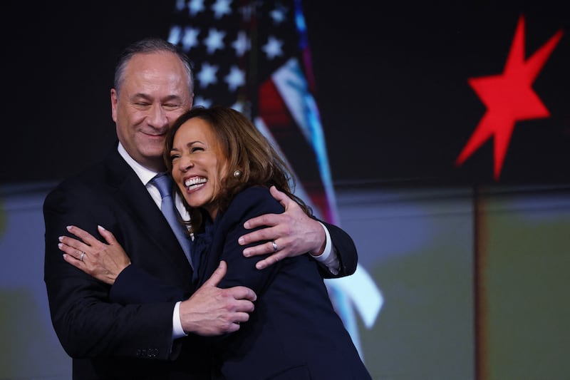 Democratic presidential nominee and Vice President Kamala Harris embraces her husband Doug Emhoff.