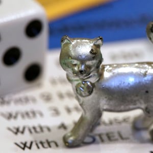 articles/2013/02/06/fidel-castro-hates-monopoly-12-more-reasons-to-love-it/130206-monolopy-cat-piece-cheat_lxmjsr