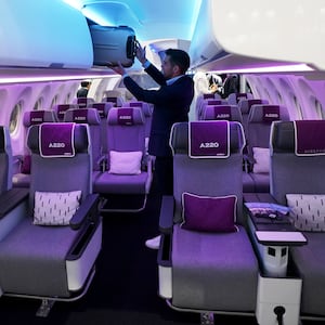 A photograph of the interior of the Airspace cabin of an Airbus A220.