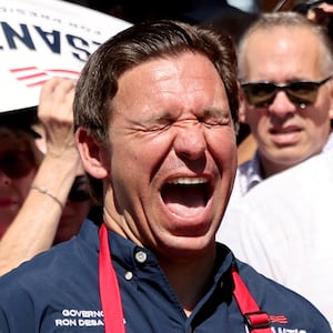 Ron DeSantis with his mouth opened wide at a campaign event at the Iowa State Fair.