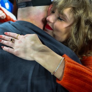 A detailed view of Taylor Swift's hand as she hugs Travis Kelce #87 of the Kansas City Chiefs after a 17-10 victory against the Baltimore Ravens in the AFC Championship Game at M&T Bank Stadium on January 28, 2024 in Baltimore, Maryland.