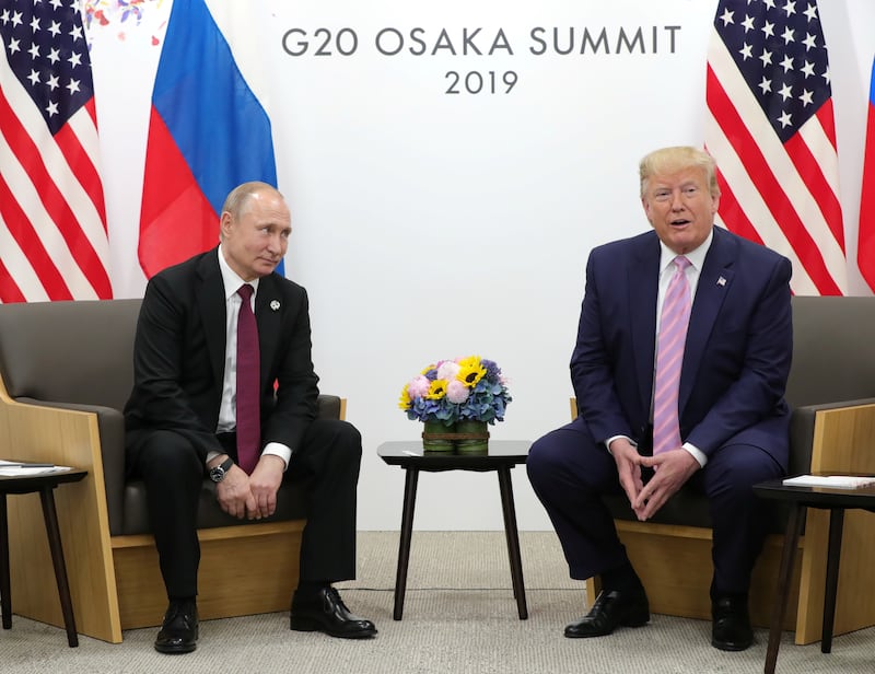 Vladimir Putin. left, and Donald Trump attend a meeting on the sidelines of the G20 summit in Osaka, Japan June 28, 2019.