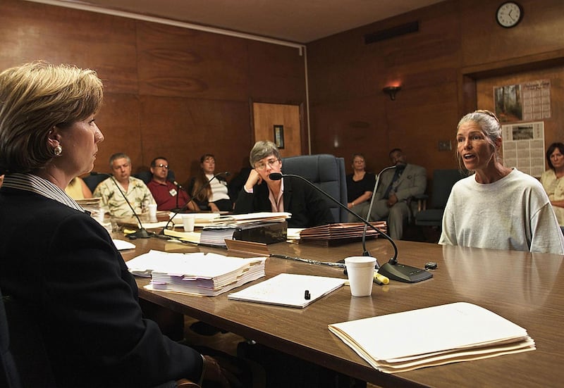 A picture of Leslie Van Houten talking to the Board of Prison Terms commissioners after she was denied parole