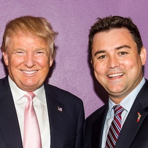 A photo of Florida GOP Chair Christian Ziegler posing with former President Donald Trump.