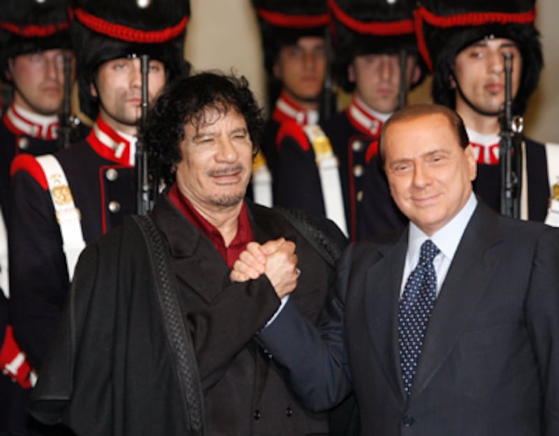 articles/2011/03/23/berlusconi-and-qaddafi-their-close-friendship/nadeau-gaddafi-exile_168649_duhatq