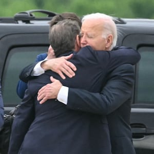 U.S. President Joe Biden hugs his son Hunter Biden upon arrival at Delaware Air National Guard Base in New Castle, Delaware.