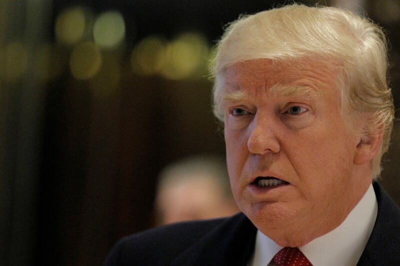 Donald Trump speaks to members of the press at Trump Tower in Manhattan