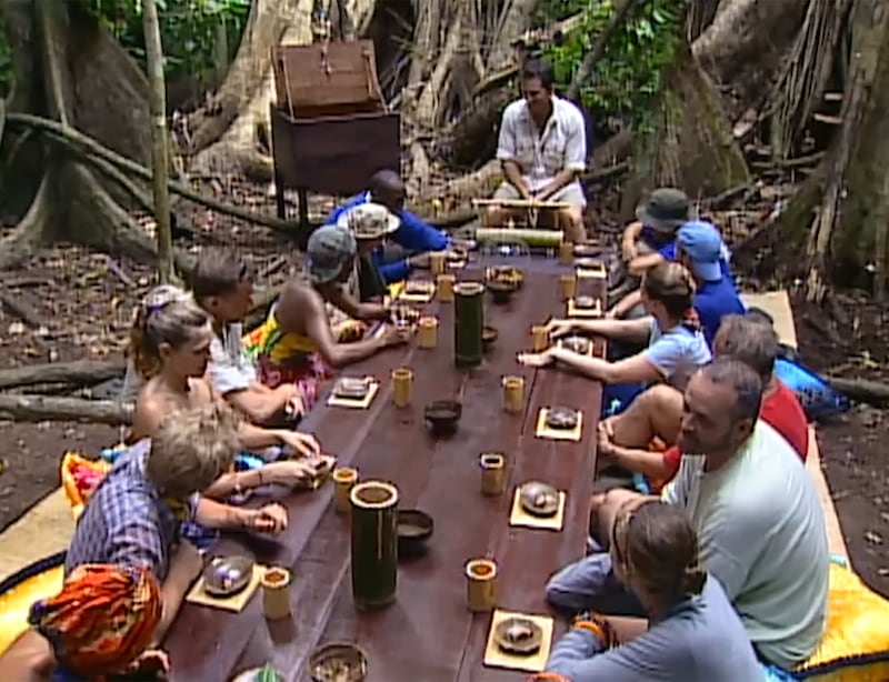 Survivor: Borneo are challenged to eat live grubs.