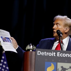 Trump read out a newspaper story saying he was once made Man of the Year in Michigan but the story was corrected.