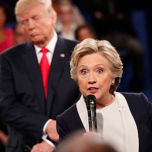 Democratic nominee Hillary Clinton (R) and Republican Presidential nominee Donald Trump participate in a town hall debate at Washington University in St. Louis, Missouri, on October 9, 2016.