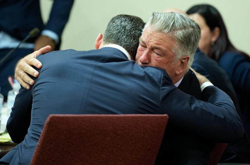 Alec Baldwin hugs his attorney Alex Spiro after his trial for involuntary manslaughter was dismissed by a judge Friday