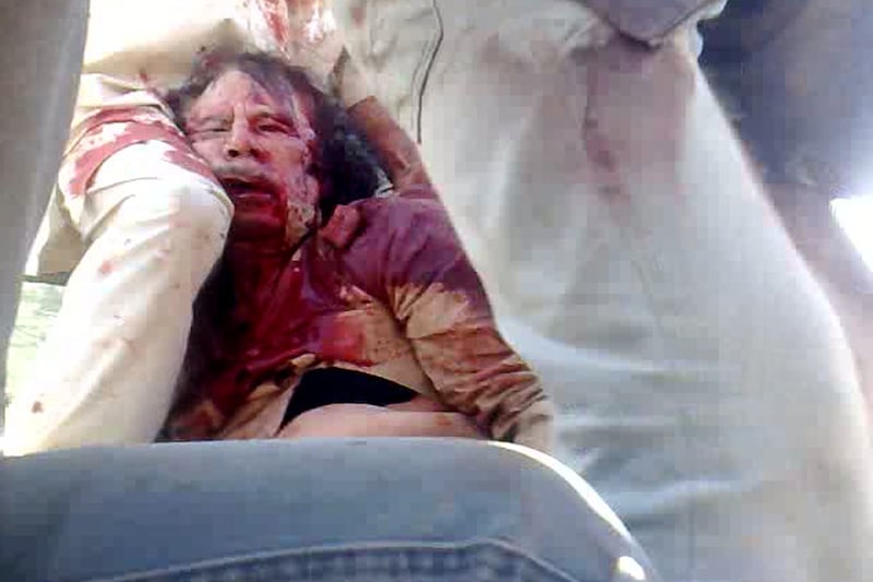 articles/2011/10/20/muammar-gaddafi-reportedly-captured-said-to-be-critically-wounded/gaddafi-death-photo_fcgzi0