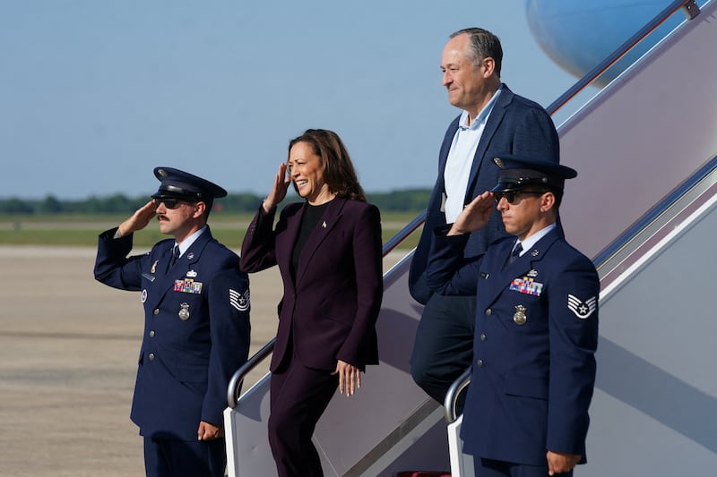 Democratic presidential nominee and U.S. Vice President Kamala Harris and second gentleman Doug Emhoff step from Air Force Two as they arrive at Joint Base Andrews, Maryland, U.S., August 23, 2024.  