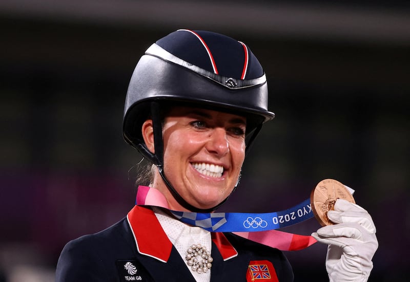 Charlotte Dujardin of Britain poses with her bronze medal at the Tokyo 2020 Olympics. 