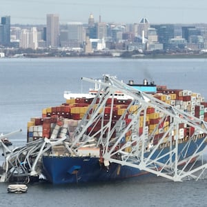 The frame of the Francis Scott Key bridge in Baltimore sits on top of the cargo ship Dali after the collapse.