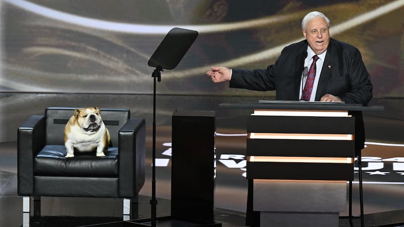 West Virginia Gov. Jim Justice and his dog, Babydog, on stage during the Republican National Convention in Milwaukee, Wisconsin in July.