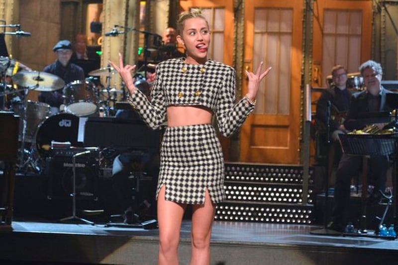 articles/2013/10/06/miley-cyrus-twerks-out-a-stellar-saturday-night-live-hosting-stint/131006-fallon-miley-snl-tease_lise3q