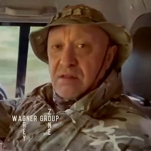 Yevgeny Prigozhin, chief of Russian private mercenary group Wagner, gives an address in camouflage inside a vehicle at an unknown location, in this still image taken from video possibly shot in Africa and published August 31, 2023.