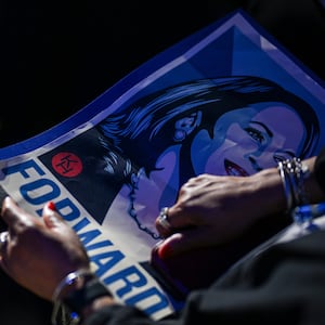 An attendee holds a poster depicting Democratic presidential candidate, U.S. Vice President Kamala Harris during the first day of the Democratic National Convention at the United Center on August 19, 2024 in Chicago, Illinois.