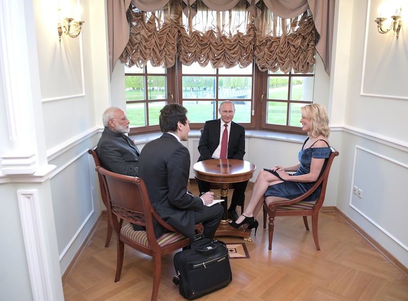 Russian President Vladimir Putin and Indian Prime Minister Narendra Modi talk to journalist Megyn Kelly  during the St. Petersburg International Economic Forum on June 1, 2017.