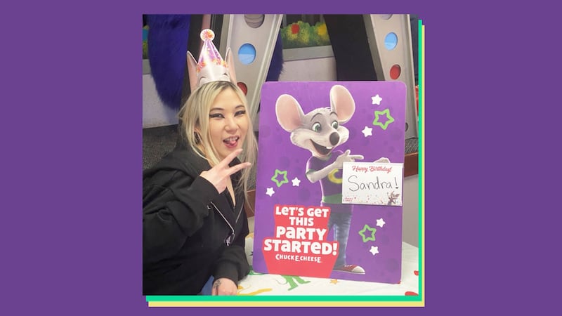 Photograph of author with a birthday cake at Chuck E. Cheese.